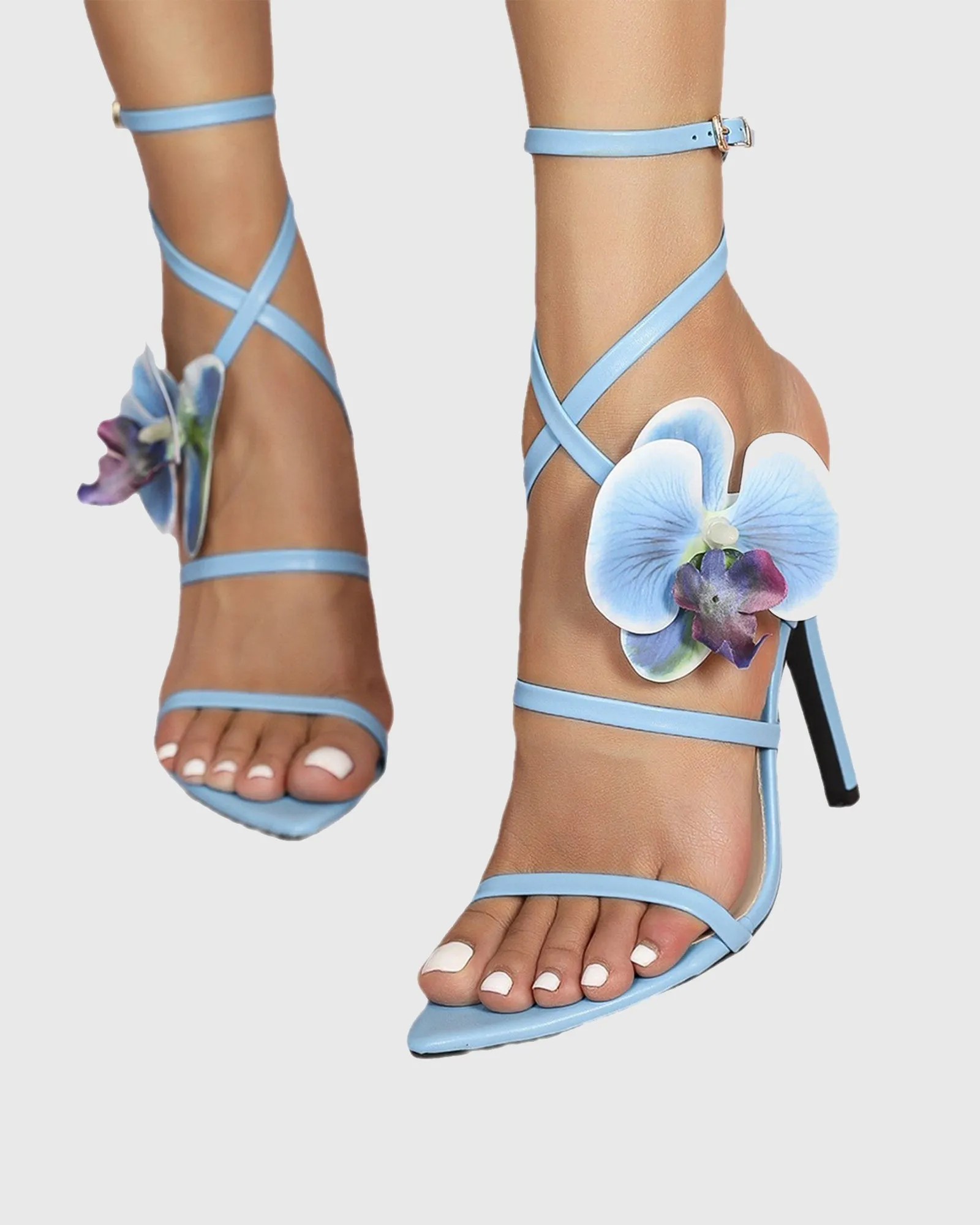 Oria Flower Embellished Cross Strap Sandals In Blue